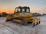 Used Dozer under setting sun